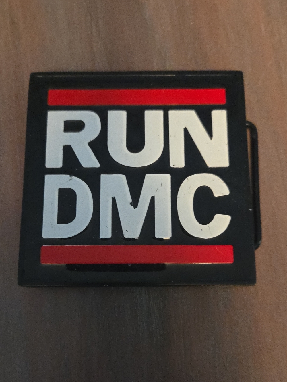 Run DMC logo belt buckle, featuring the legendary hip-hop group